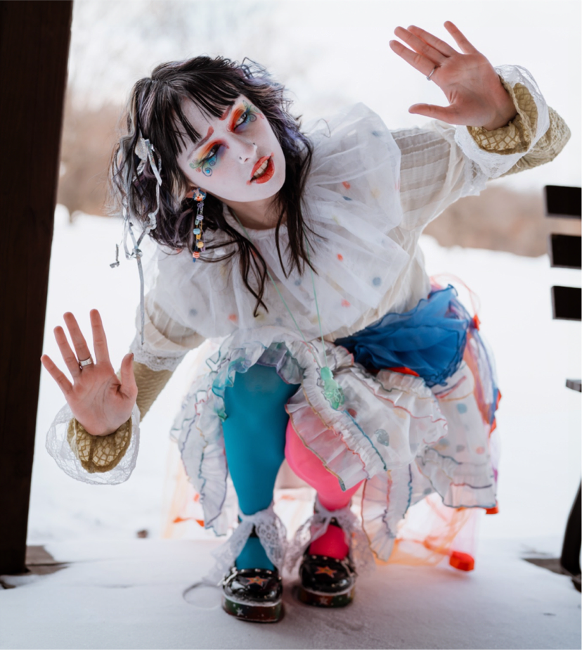 Portrait of Clime-Ma the Clown smiling with balloons